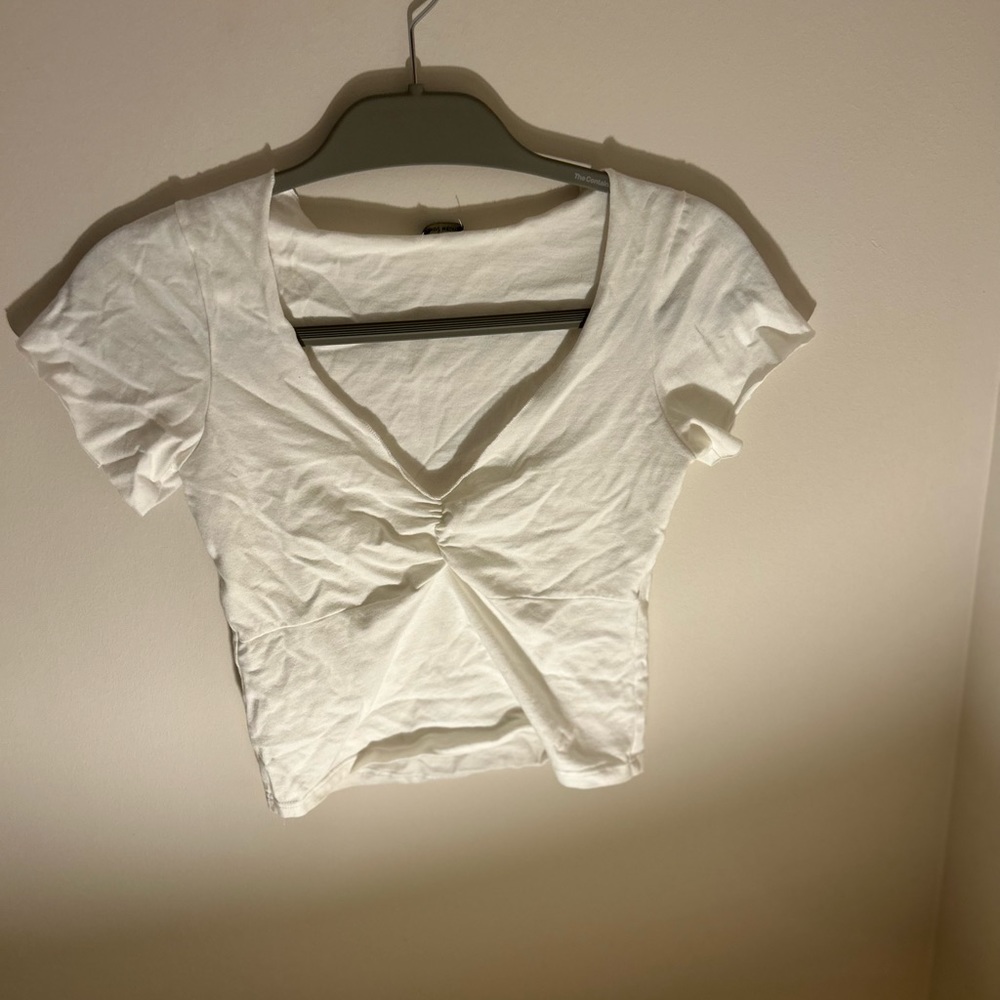 Brandy Melville cropped white tee. Cinched front V-neck.